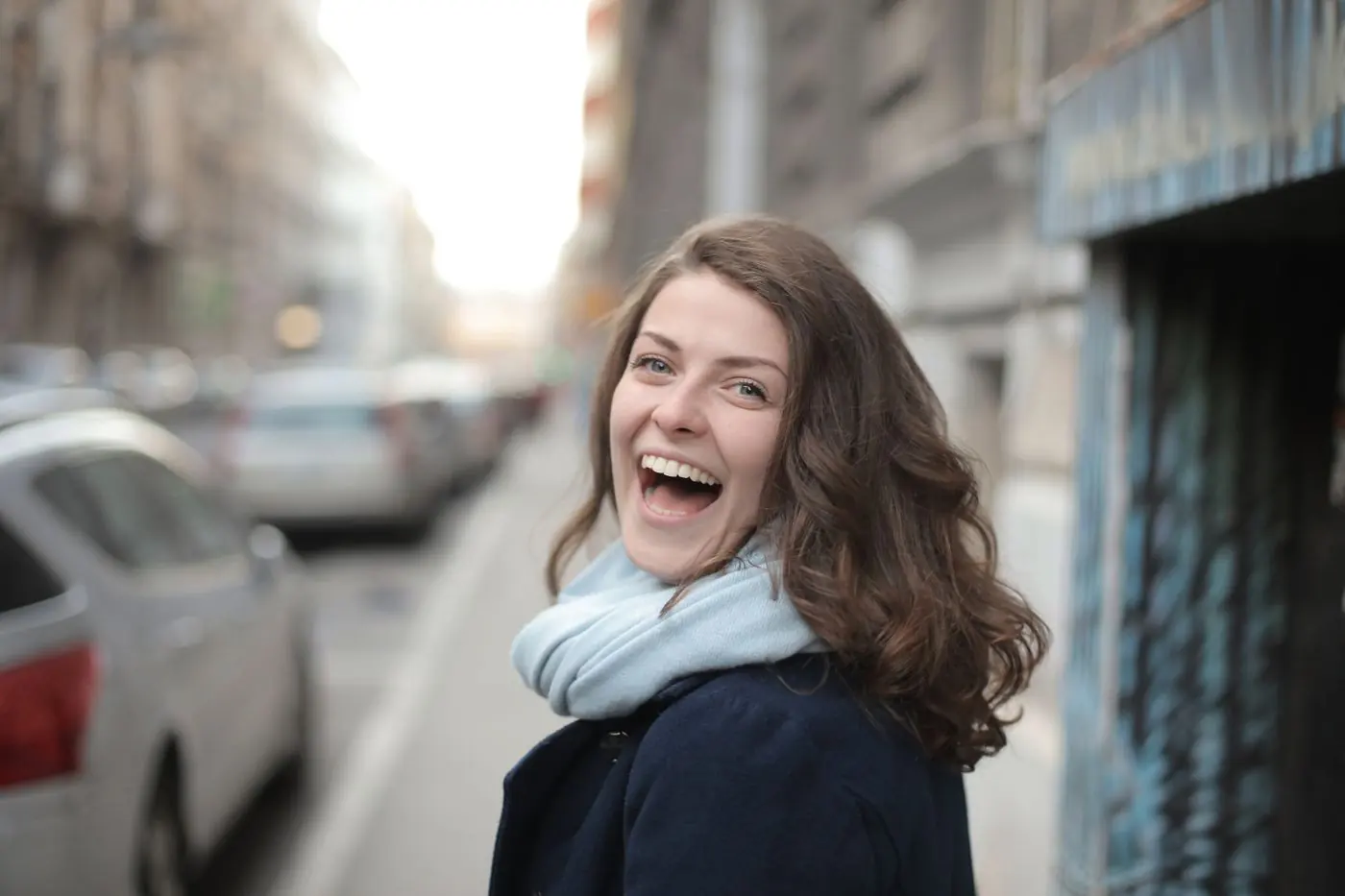 A woman smiling outdoors